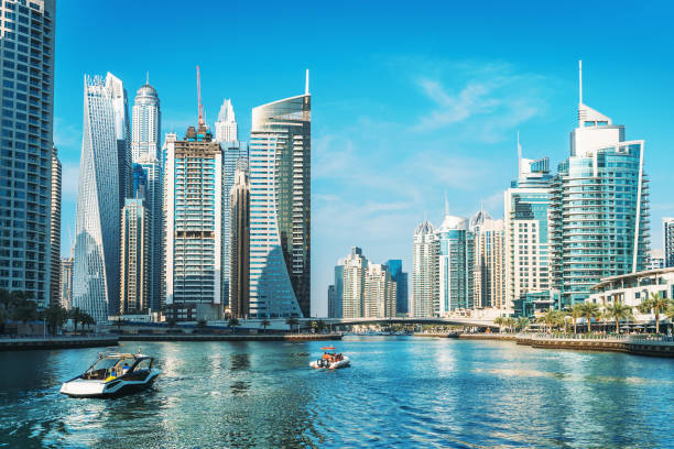 Skyscrapers and boats showcase the modern infrastructure appealing to businesses in KIZAD Free Zone.